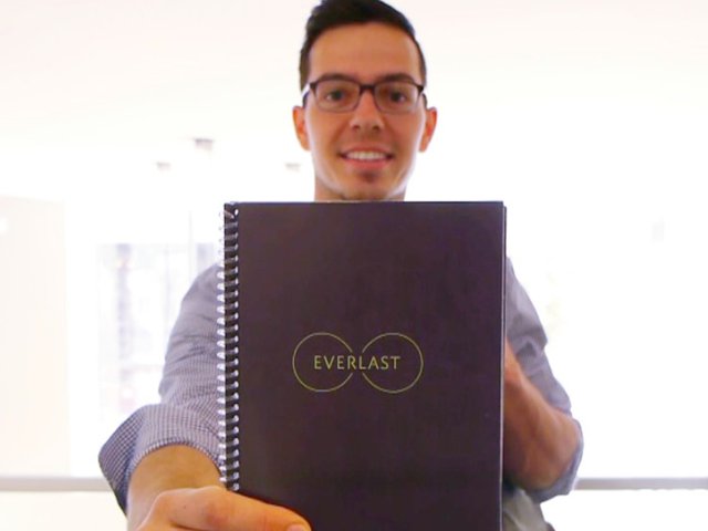 Rocketbook Everlast - Lifestyle - At Work - Professional Holding Up Book.png