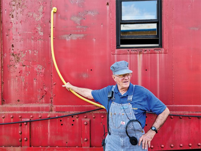 train-museum-conductor-red-car.png