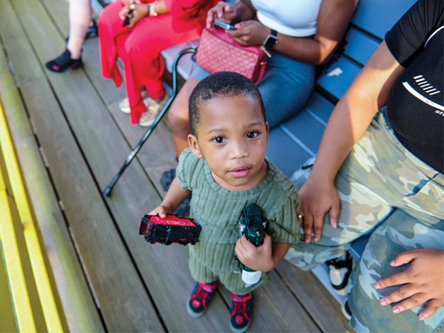 train-museum-boy-with-toy-train.png