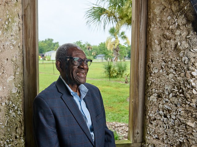 Thomas Barnwell poses in the window of an 18th-century tabby he’s preserved on his familys property on Hilton Head Island.png